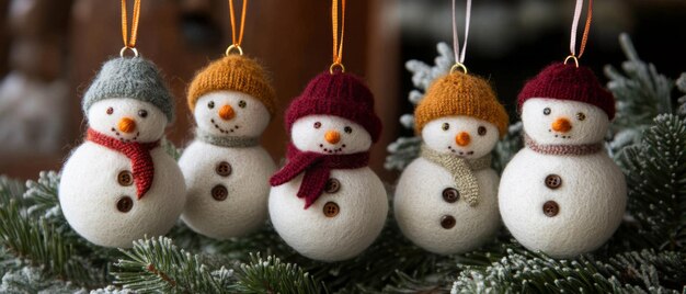 Five Knitted Snowman Ornaments Hanging on a Christmas Tree