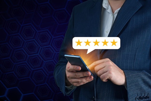 Five stars testimonial Customer review good rating concept hand pressing five star on screen