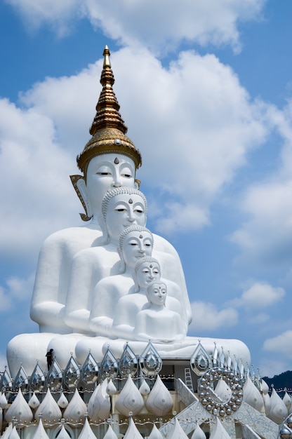 Five white buddha with cloud sky background.