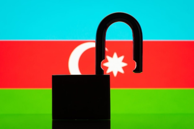 Flag of Azerbaijan with silhouette of lock on the foreground Reopen country Azerbaijan open borders concept