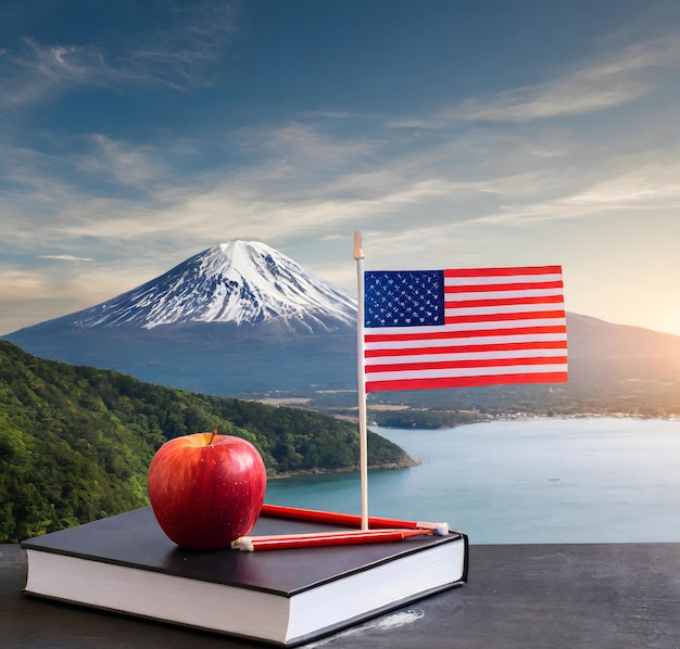 a flag on a book with a mountain in the background