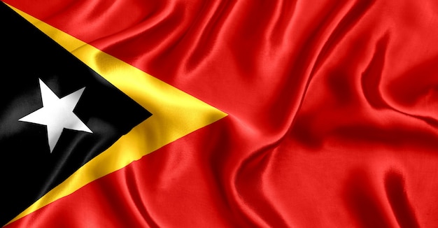 Flag of East Timor silk close-up background