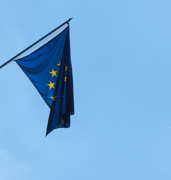 Flag of the European Union (EU) over blue sky