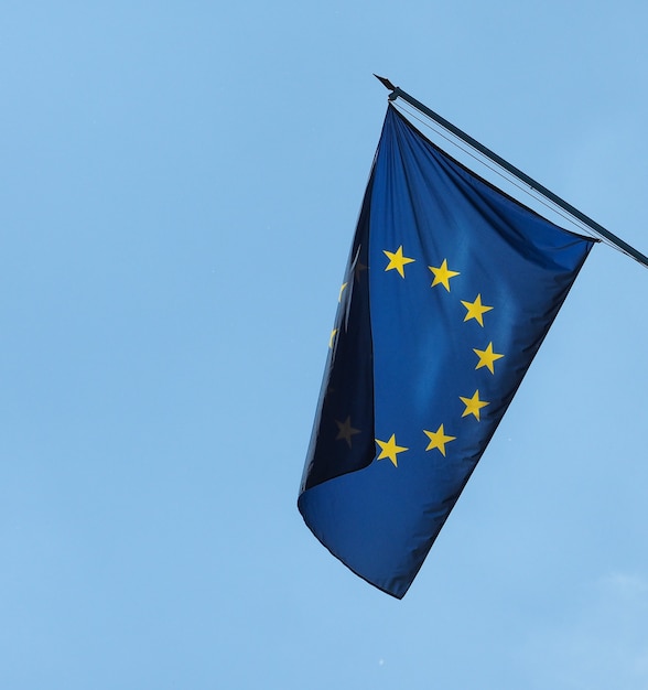 Flag of the European Union (EU) over blue sky