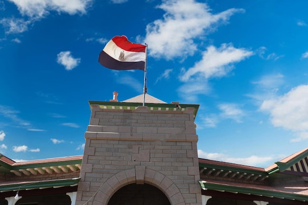 A flag flies on a building in the capital of the republic of morocco.