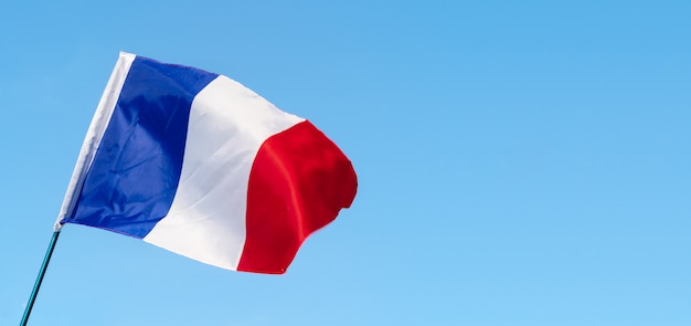 Flag of France waving in the wind in the sky