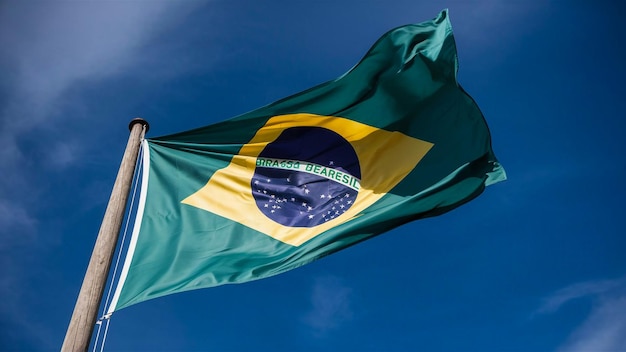 a flag is waving in the wind with a blue sky in the background