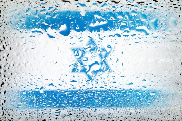 Flag of Israel Israel flag on the background of water drops Flag with raindrops Splashes on glass