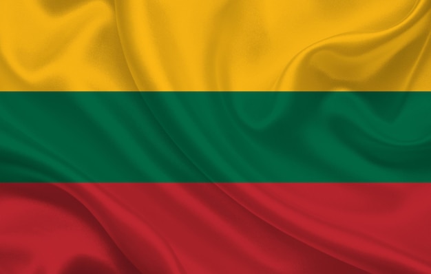 Flag of lithuania country on wavy silk fabric background panorama - illustration