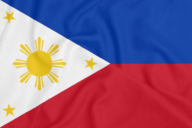 Flag of Philippines on textured fabric. Patriotic symbol