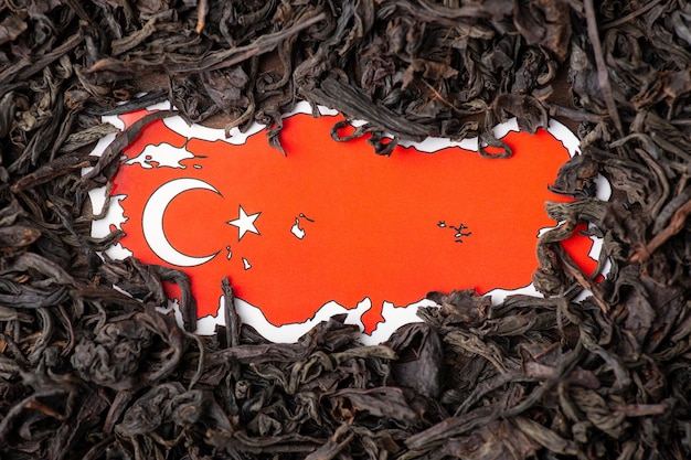 Flag of Turkey and tea foliage around Harvest of tea in Turkey