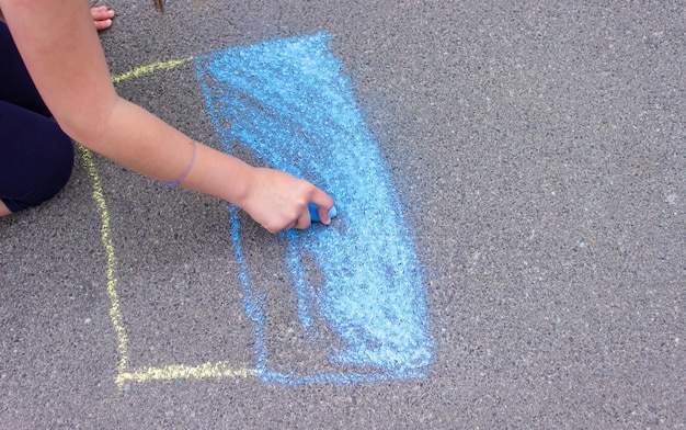 Flag of Ukraine Chalk drawing on sidewalk Creative support by children for Ukraine