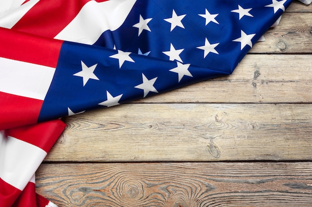 flag of the United States of America on wooden background. USA holiday of Veterans, Memorial, Independence and Labor Day.