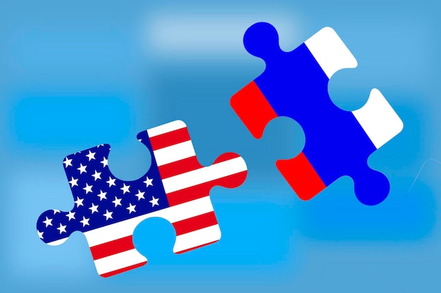 The flag of the USA and the flag of Russia in the form of puzzles on a blue background, the concept of economic, financial, political and military relations between the two countries.