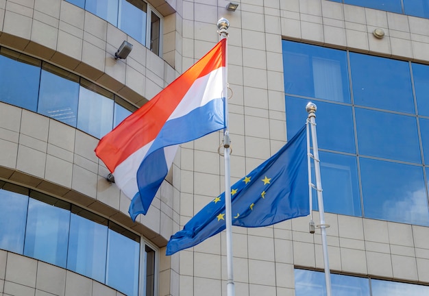 Flags of the Netherlands and European Union on flagpole