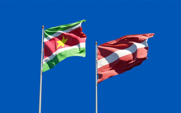 Flags of Suriname and Latvia. 3D artwork