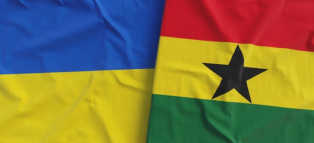 Flags of Ukraine and Ghana Linen flag closeup Flag made of canvas Ukrainian flag Accra State national symbols 3d illustration