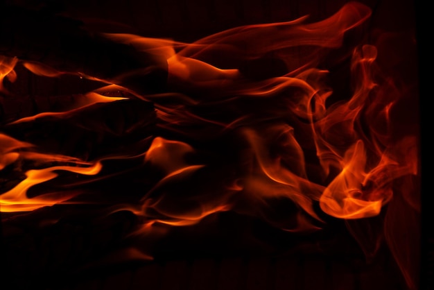 Photo flames of fire on a black background soft focus horizontal orientation