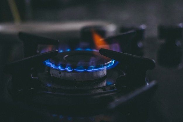 a flames from the gas stove embedded in the counter in the kitchen.