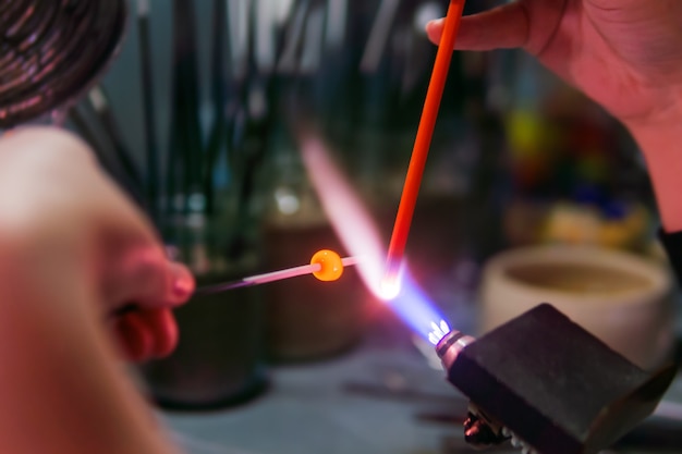 Flameworking  making glass beads manually using a hightemperature burner