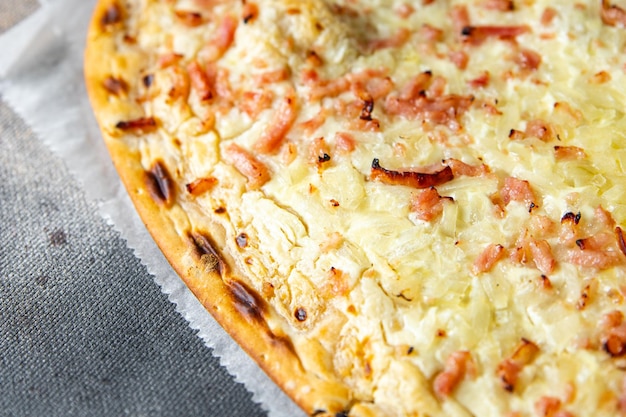 Flammkuchen savory pie bacon, onion, sour cream pastrie meal food snack on the table copy space