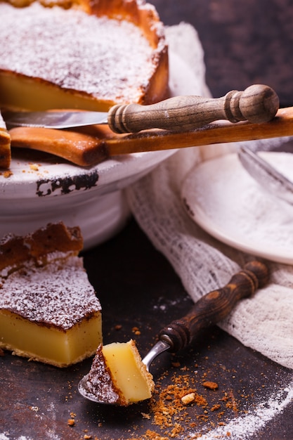 Flan at home, sprinkled with powdered sugar.