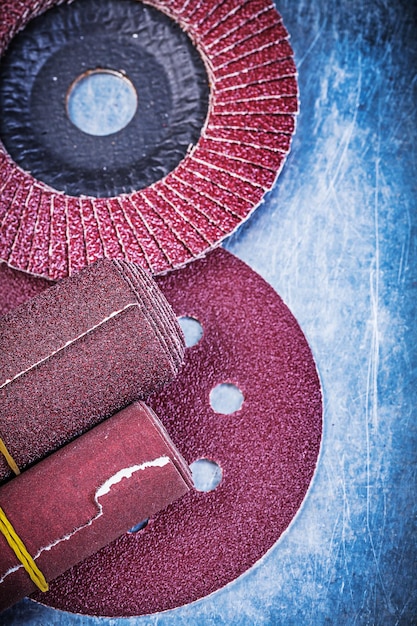 Flap grinding discs abrasive wheels rolled sandpaper on metallic background