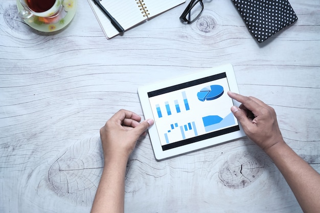 Flat composition of analyzing financial chart on digital tablet