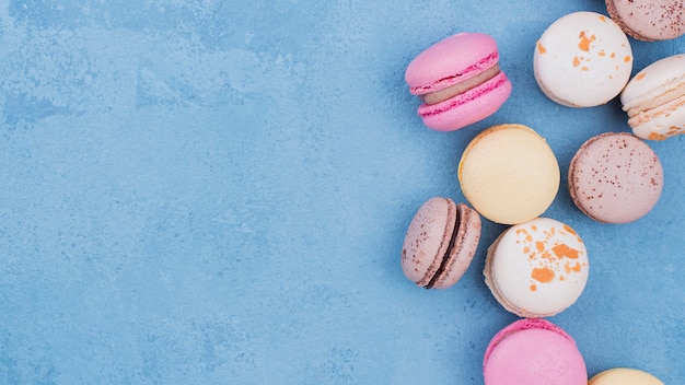 Flat lay of assortment of macarons with copy space