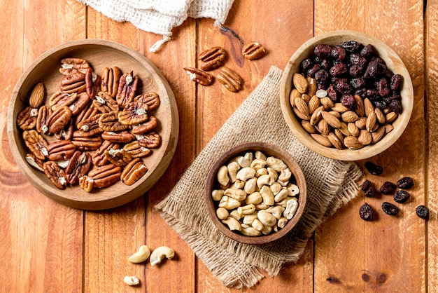 Flat lay of bowls with walnuts and peanuts