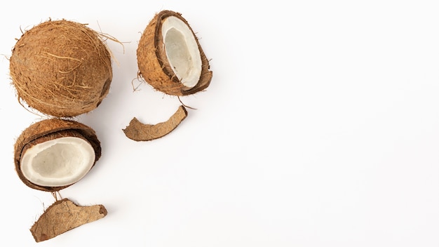 Flat lay of coconut with shell and copy space