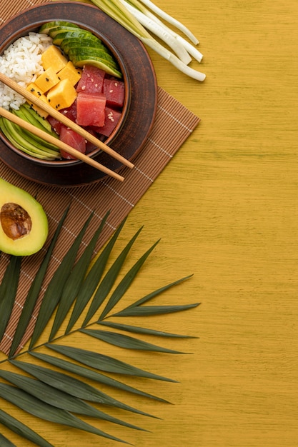 Flat lay composition of delicious poke bowl