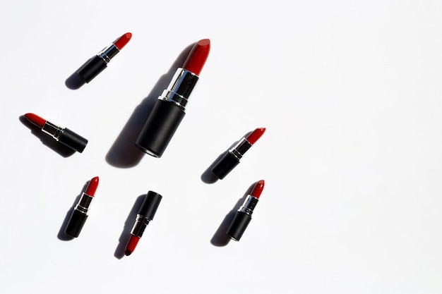 Flat lay composition, Lipsticks on white background with shadow. Beautiful Make-up concept