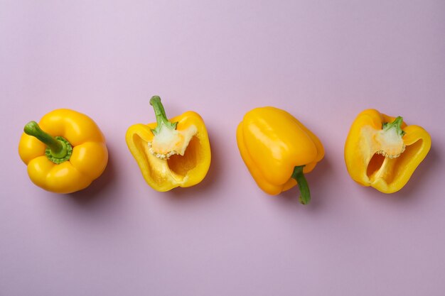 Flat lay composition with bell pepper on purple background