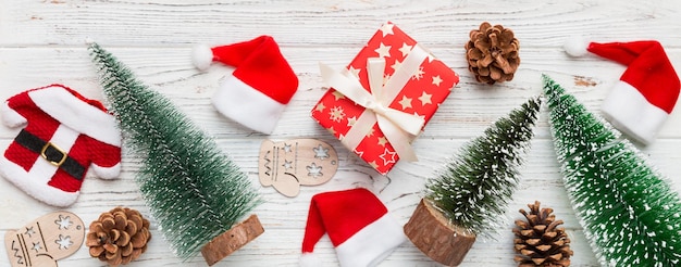 Flat lay composition with christmas trees on color background Top view with copy space