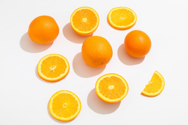 Flat lay composition with oranges on white background, space for text