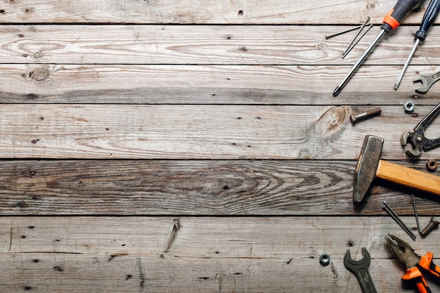 Flat lay composition with vintage carpentry tools background