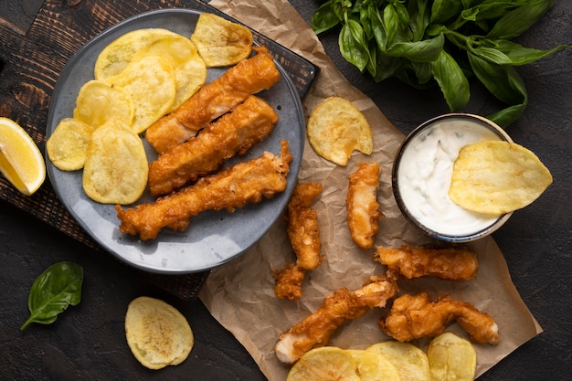 Flat lay of delicious fish and chips concept