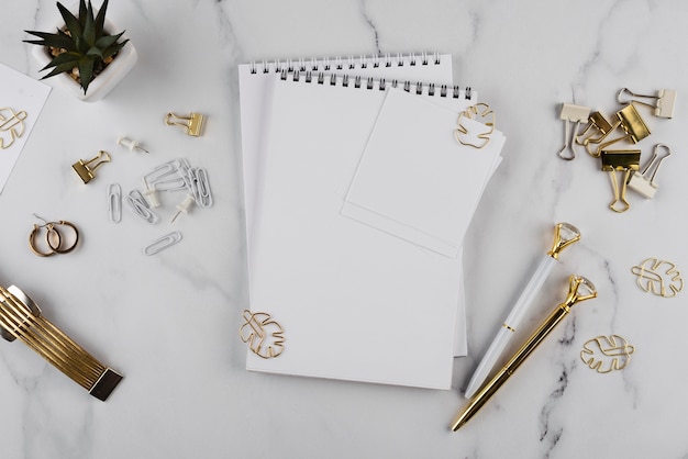 Flat lay desk items on marble table