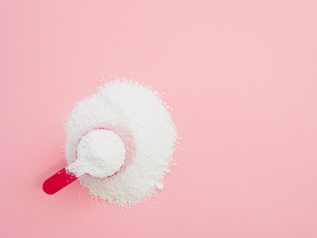 Flat-lay detergent powder on colorful background