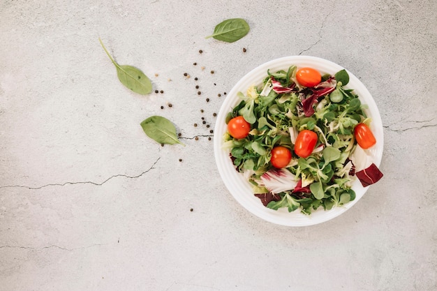 Flat lay of dishes with salad and spinach