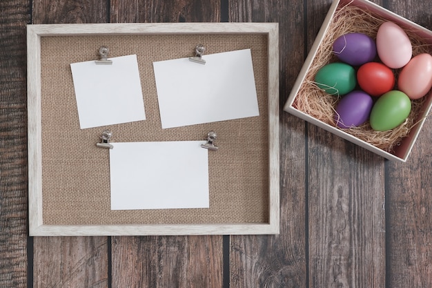 Flat-lay Easter eggs on wooden table.