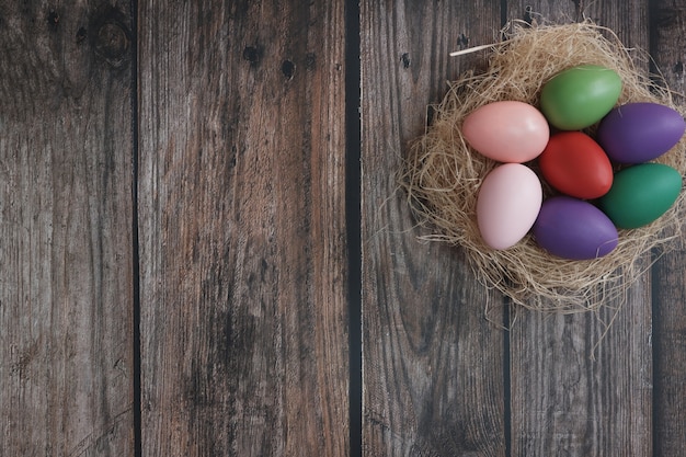 Flat-lay Easter eggs on wooden table.