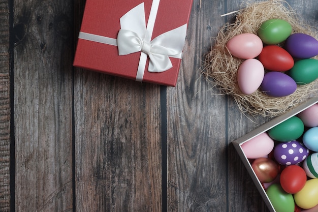 Flat-lay Easter eggs on wooden table.