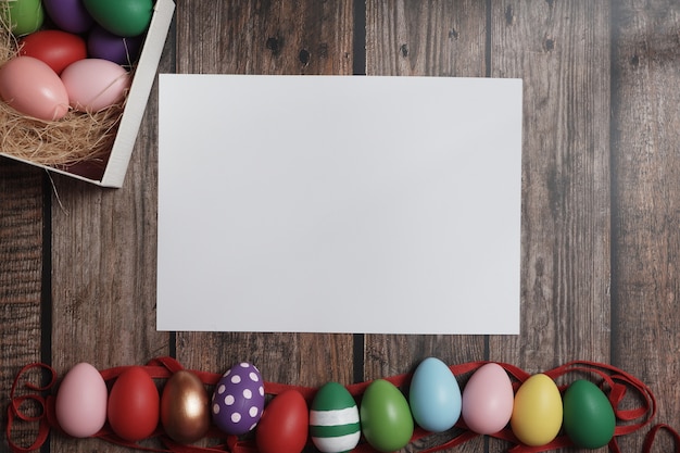 Flat-lay Easter eggs on wooden table.