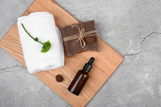 Flat lay on eco cosmetics. Flat layout with accessories, spa cosmetics, bath salt, cream and towels. Skin care product, natural cosmetics, flat styling.