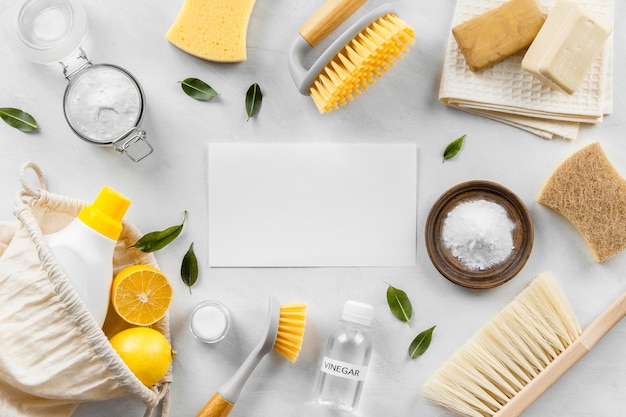 Flat lay of eco-friendly cleaning products collection with brushes and baking soda