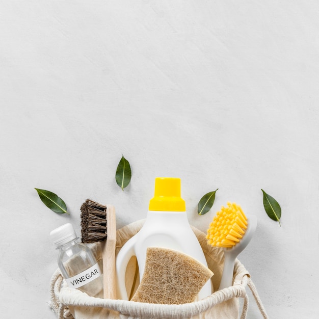 Photo flat lay of eco-friendly cleaning products collection with copy space and brushes