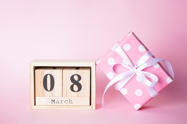 Flat lay gift and March 8 wood calendar