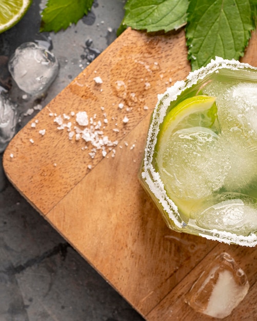 Flat lay glass with lime and ice